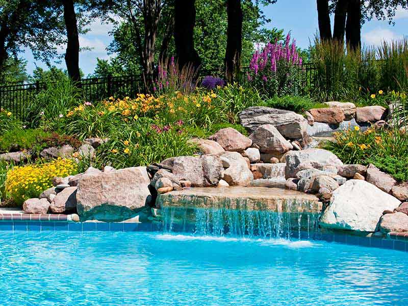 The beautiful poolside of a waterfall with rocks